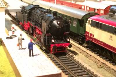 All aboard! The Stationmaster giving the all clear to the BR 18 locomotive driver.