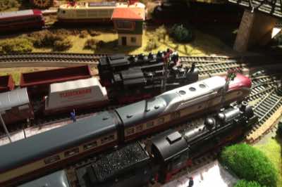 VT 11.5 TEE and three steam locomotives.